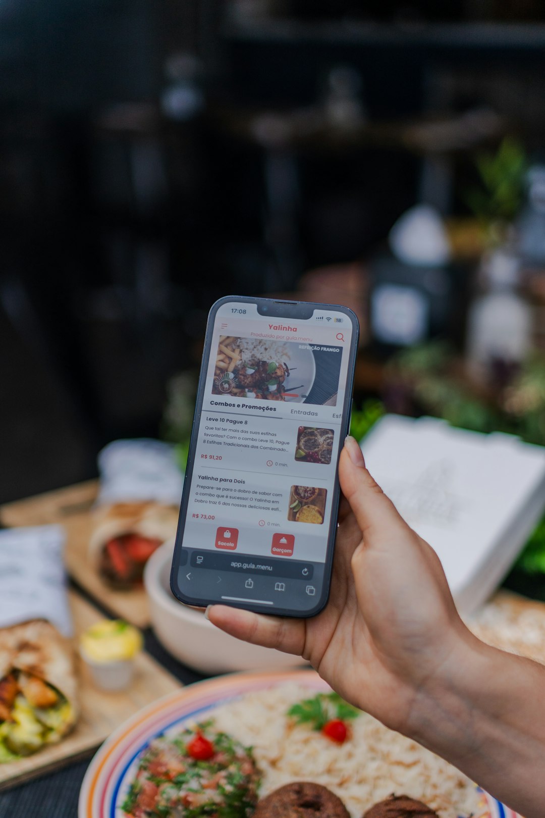 services-01 hand-holding-smartphone-displaying-food-ordering-app-ul37flwpyus
